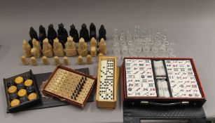 A quantity of chess sets, dominoes, etc.