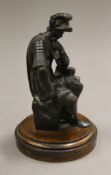 A 19th century bronze model of a centurion mounted on a later wooden plinth base. 13.5 cm high.