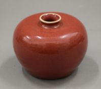 A small Chinese red ground porcelain vase. 6.5 cm high.