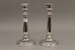 A pair of 19th century Sheffield plated candlesticks. 26 cm high.