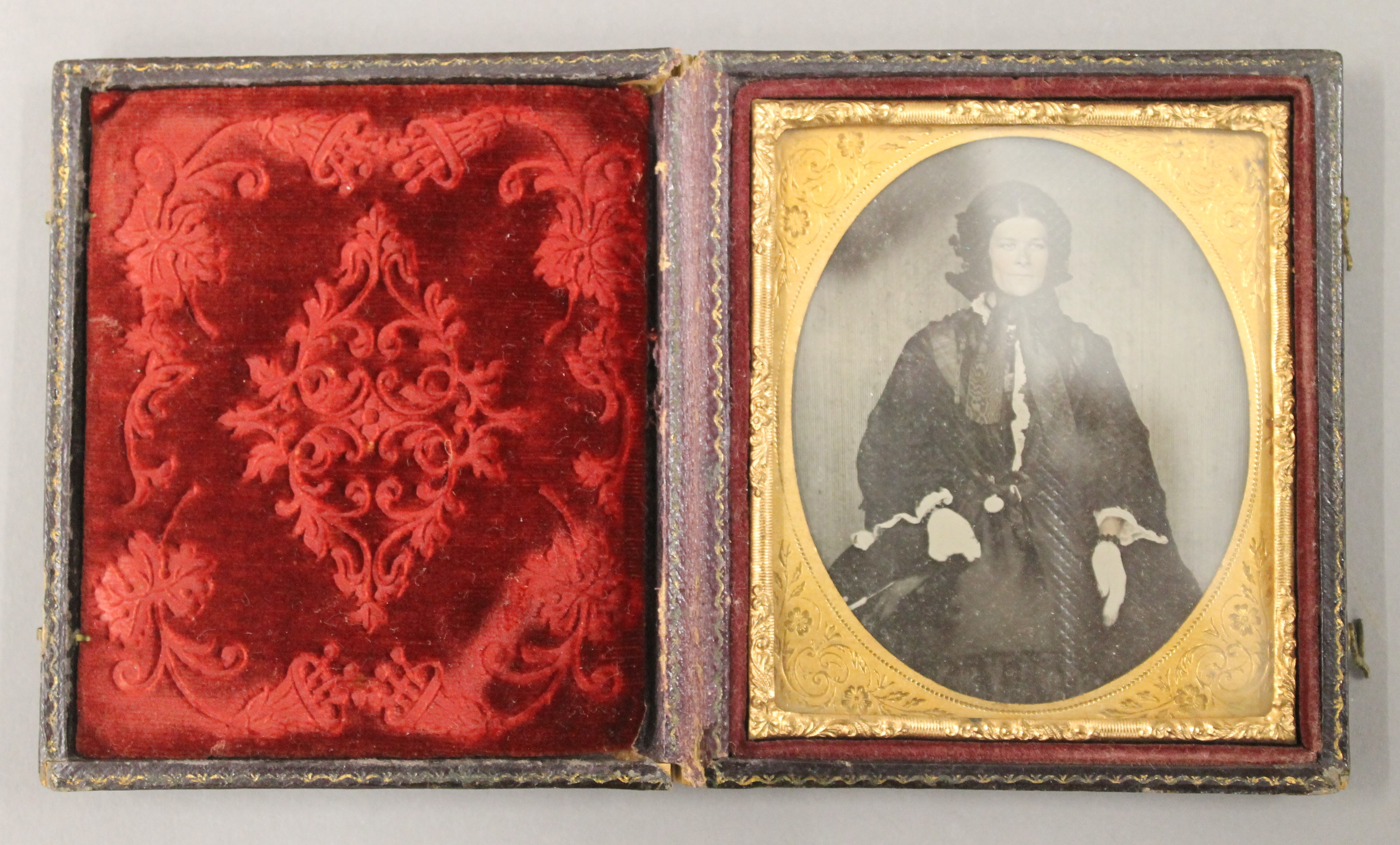 Two Victorian glass plate photograph portraits.