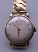 A 9 ct gold cased gentleman's wristwatch. 47.4 grammes total weight.