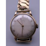 A 9 ct gold cased gentleman's wristwatch. 47.4 grammes total weight.