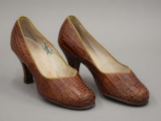 A pair of vintage Eastern snakeskin shoes. Each 22 cm long.