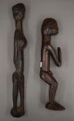 Two carved tribal wooden figures. The largest 49 cm high.