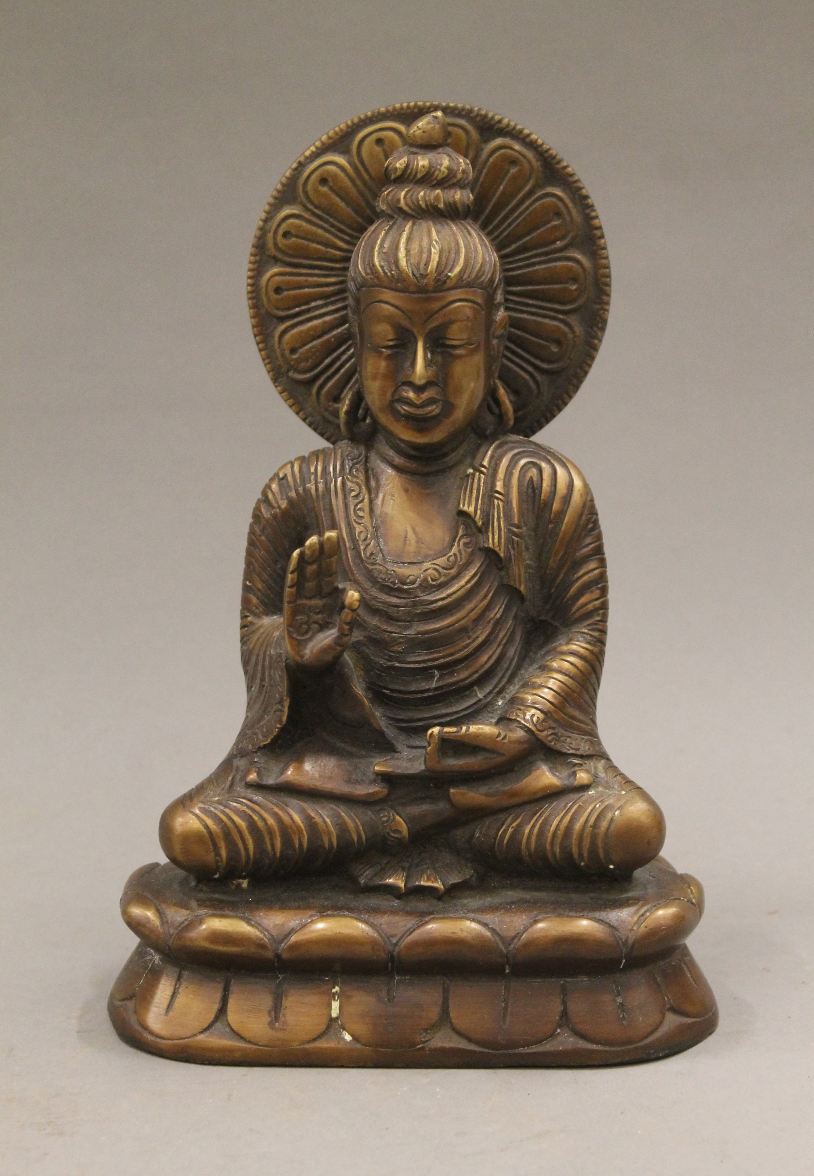 A bronze model of Buddha. 21 cm high.