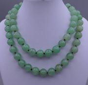 A string of jade beads. Approximately 84 cm long.