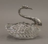 A silver mounted and cut-glass swan form vase. 13 cm long.