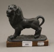 A 19th century cast model of a lion. 16 cm long.