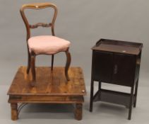 An Eastern coffee table, a two door cupboard and a Victorian balloon back chair.