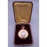 A 9 ct gold half hunter pocket watch. 92 grammes total weight.