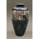 A Royal Doulton florally decorated vase. 22.5 cm high.