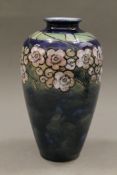 A Royal Doulton florally decorated vase. 22.5 cm high.