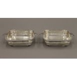 A pair of silver pierced dishes. Each 16 cm wide. 10 troy ounces.