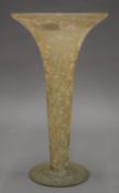 An etched glass trumpet vase. 36.5 cm high.