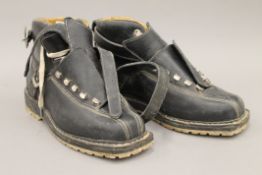 A pair of Vibram Brevettata vintage ski boots retailed by Lilywhites. 28 cm long.