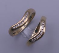Two 9 ct gold nine stone diamond wishbone rings. Ring sizes K/L. 3.8 grammes total weight.