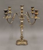 A silver plated four branch candelabra.