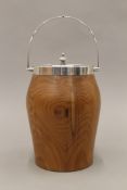 An early 20th century silver mounted yew wood biscuit barrel. 27 cm high overall.