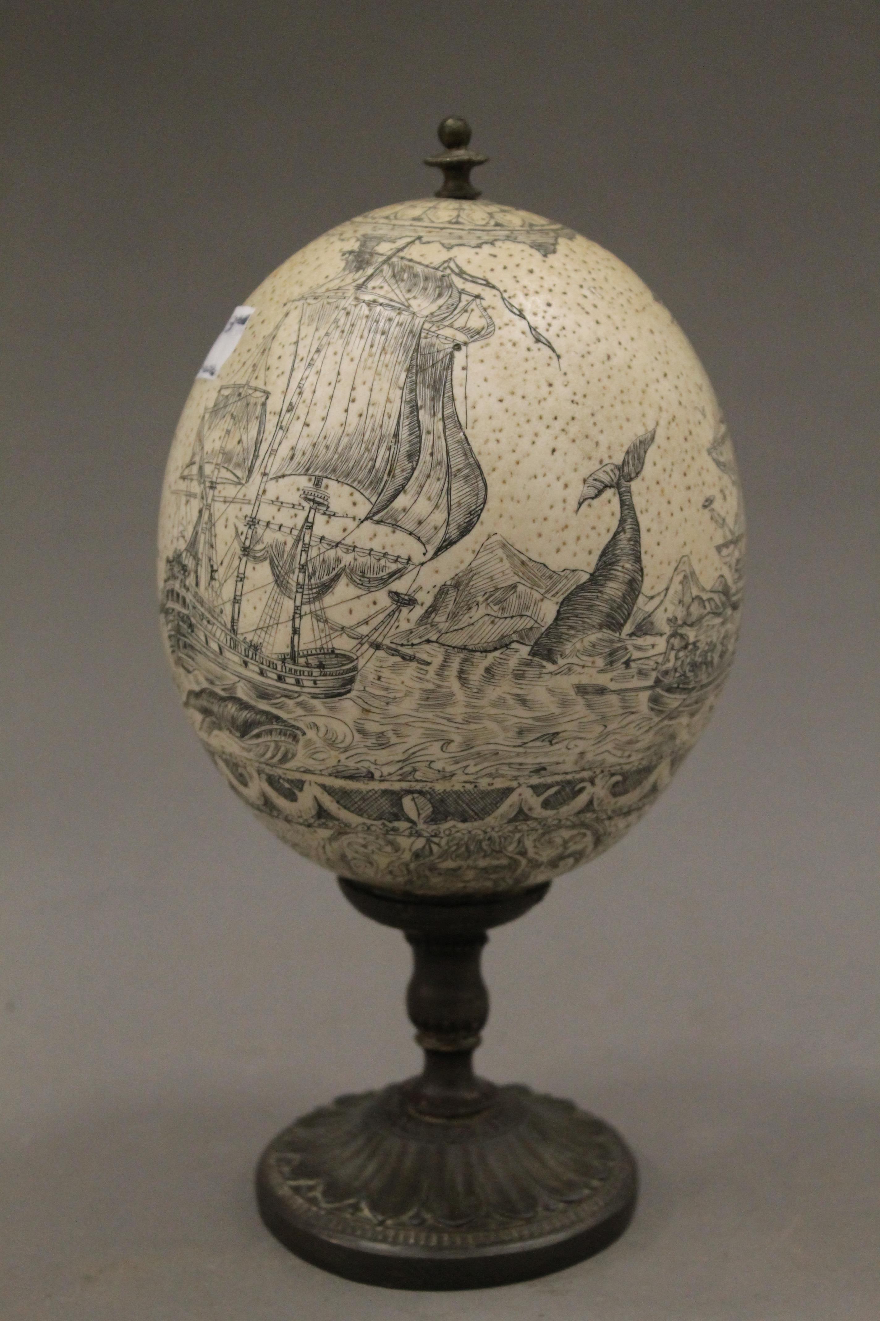 A carved and mounted ostrich egg. 23 cm high. - Image 2 of 5