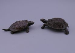 Two Japanese bronze models of tortoises. The largest 6 cm long.