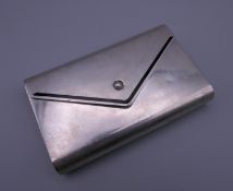 A Cartier silver envelope purse. 10 cm wide. 147.2 grammes total weight.