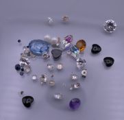 A bag of various gemstones, including diamonds, sapphires, etc.