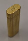 A Cartier cigarette lighter.