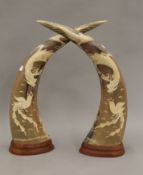 A pair of Oriental carved horns. The largest 43 cm high.