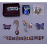 A quantity of enamel jewellery.