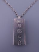 A silver ingot on chain. Ingot is 4 cm high. 41.2 grammes.