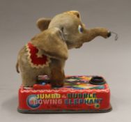 A tin plate Jumbo The Bubble Blowing Elephant toy. 18 cm high.