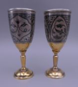 A pair of Russian silver and niello goblets. 11.3 cm high. 4.6 troy ounces.