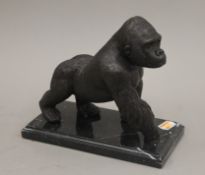 A bronze model of a gorilla. 18 cm high.