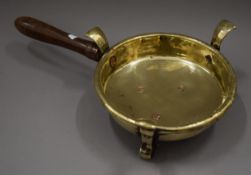 An 18th century brass chafing pan. 25 cm wide.