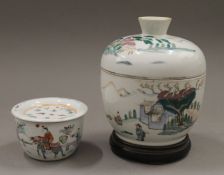 A late 19th century Chinese porcelain bowl and cover on a wooden stand and a similarly decorated