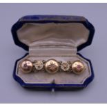 A Victorian unmarked gold, diamond, ruby and sapphire brooch. 5.5 cm wide. 7.9 grammes total weight.