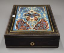 A 19th century French Boulle work artist's box with paints and equipment, with its key. 20.