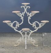 A Victorian white painted cast iron plant stand. 108 cm high.