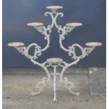 A Victorian white painted cast iron plant stand. 108 cm high.
