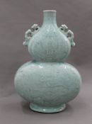 A Chinese porcelain double gourd celadon vase. 27 cm high.