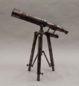 A telescope on stand. 27 cm long.