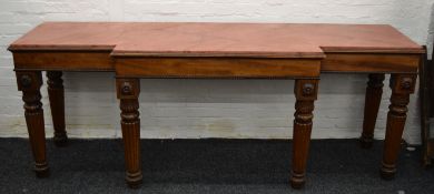 An early 19th century mahogany serving table with replaced top. 245 cm wide.