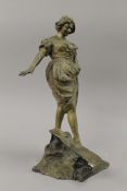 A bronze model of a girl on a foot bridge. 34 cm high.