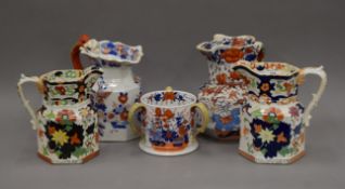 A Masons Tyg, two Masons jugs and two other Ironstone jugs. The former 13 cm high.