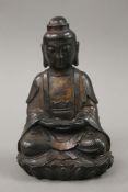 A bronze seated model of Buddha. 19.5 cm high.