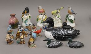 A collection of four Peter Barret porcelain bells and other bird ornaments,
