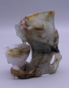 A russet and celadon jade brush washer. 6.5 cm high.