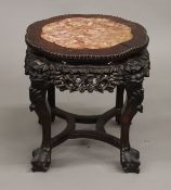 A Chinese stand with red marble top. 45.5 cm high.