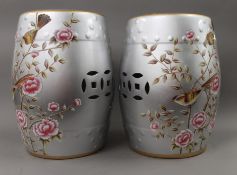 A pair of Chinese silver coloured porcelain barrel seats decorated with birds. 45 cm high.